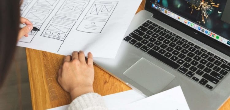 female-designer-reviewing-wireframes female-designer-reviewing-wireframes